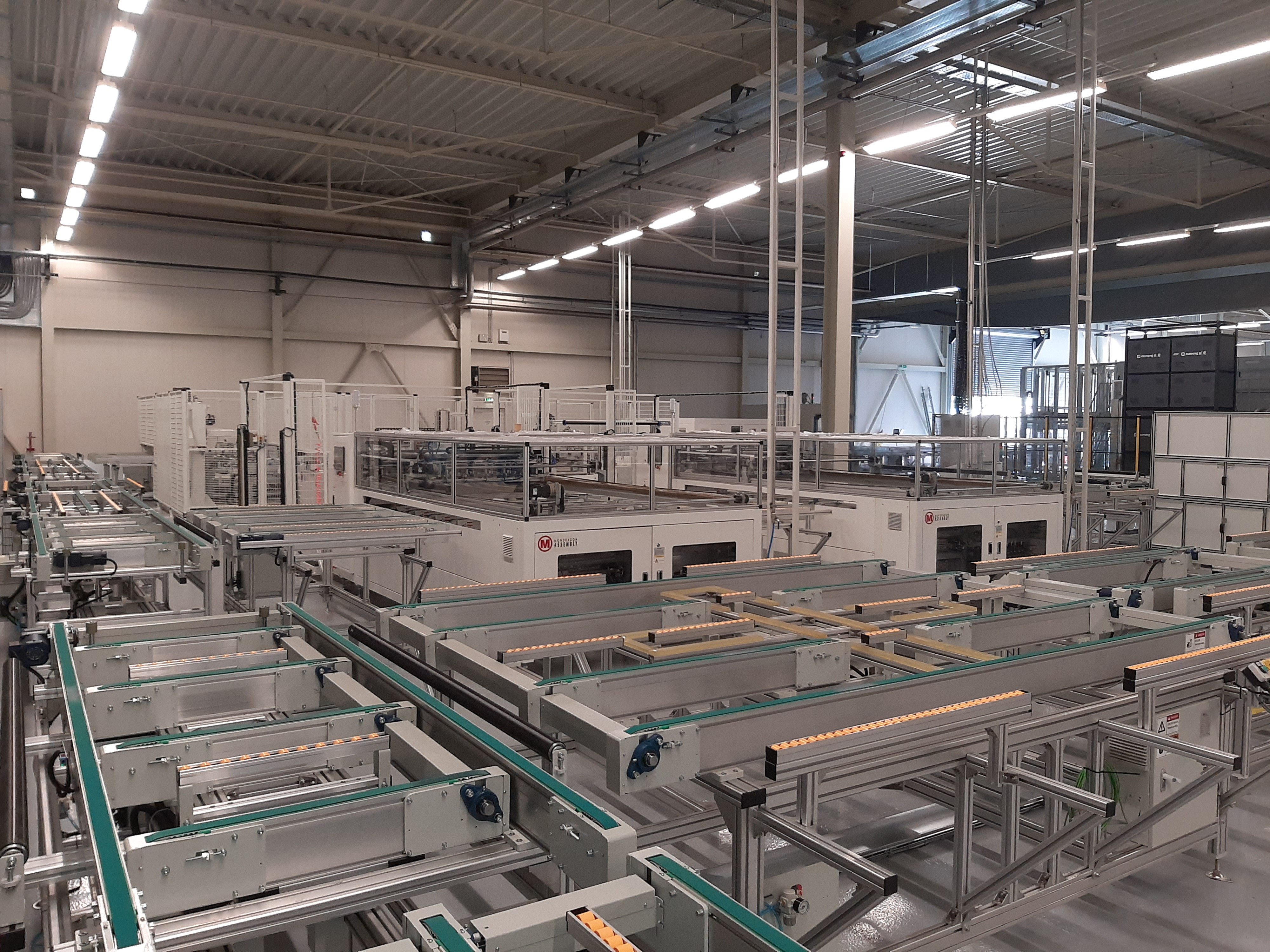 Wide-angle interior view of Brite Solar’s new factory, showcasing the scale and structure of the agrivoltaic panel production line.